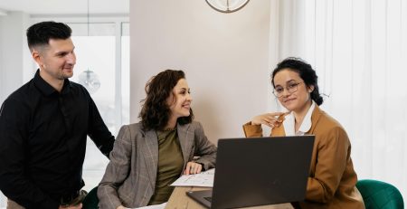 Couple meeting with a franchise consultant to explore franchises for veterans